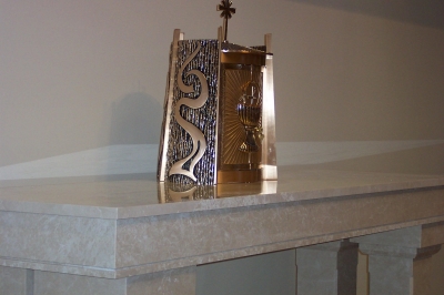 An altar made of botticino marble.