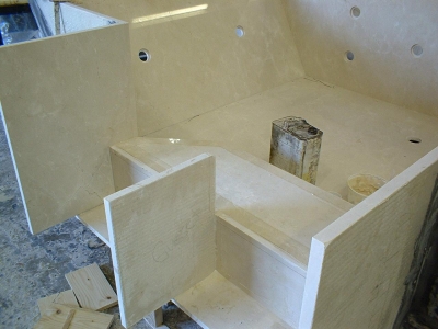 Constructing a custom Crema Marfil Marble spa.